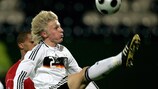 Germany's Andreas Beck holds off the attentions of Gérard Geisbusch