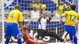 Falcão (right) beats Russia goalkeeper Sergey Zuev to put Brazil 2-0 up