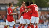 Nathan Delfouneso (No10) is congratulated after scoring one of his two goals against Slovenia