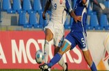 Cyprus defender Kyriakos Pelentritis (right) challenges goalscorer Jakub Sylvetr
