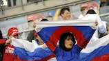 Russia fans cheer on their team