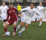 Daniils Turkovs (left) and Rógvi Holm vie for the ball during the Faroe Islands 1-0 win over Latvia in Riga