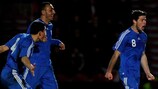 Giannis Papadopoulos (right) celebrates after scoring against England