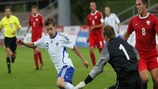 Finland striker Jonne Hjelm attempts to get the better of the Poland goalkeeper