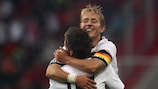 Patrick Herrmann and Lewis Holtby (top) celebrate Germany's third goal