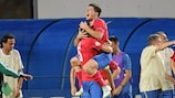 Miloš Jojić celebrates with his team-mates after scoring Serbia's opener