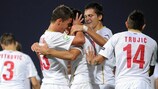 Andrej Mrkela (centre) is mobbed after scoring the goal that took Serbia into the semi-finals