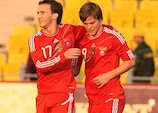 Aleksandr Kokorin (right) celebrates scoring one of his three goals in Russia's 6-0 win in Tiraspol