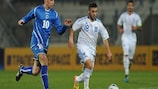 Srdjan Grahovac (left) tracks Greece's Giannis Fetfatzidis