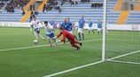 Orkhan Hasanov of Azerbaijan chases a loose ball with Iceland's Asgeir Thor Magnússon
