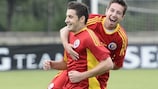 Lucian Filip and Silviu Pana celebrate a goal in Romania's 2-0 victory against Slovakia