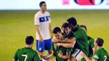 Conor Henderson is mobbed after scoring Ireland's third goal