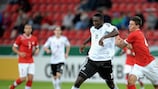 Germany's Peniel Mlapa attempts to make inroads against Switzerland