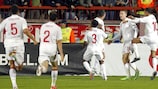 England players rush to congratulate goalscorer Connor Wickham after his late strike