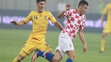 Ukraine's Ruslan Malinovskiy chases Croatia's Mateo Kovačić