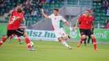 Bálint Vécsei (No19) tries to find a way through against Austria