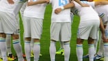Slovenia players huddle ahead of the game