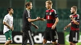 Germany coach Marcus Sorg congratulates his players after the win against Bulgaria