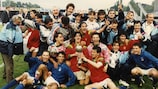 The victorious Italian squad celebrate with the trophy in 1994