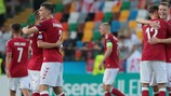 Denmark celebrate beating Austria on matchday two