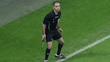 An additional assistant referee watches the action at last season's UEFA Champions League final