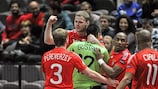 Aleksandr Fukin celebrates with goalkeeper Gustavo after rifling Russia in front