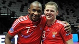 Pula (left) celebrates at full time with fellow goalscorer Aleksandr Fukin
