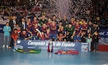 Barcelona celebrate with the trophy