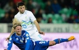 Iceland midfielder Birkir Bjarnason is challenged by Slovenia's Bojan Jokić