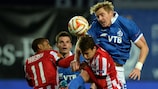Dinamo's Tomáš Hubočan rises above PSV's Luciano Narsingh and Santiago Arias