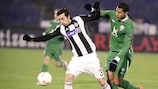 Partizan's Vladimir Volkov shields the ball from Rubin striker José Rondón