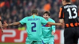 Lionel Messi and Daniel Alves celebrate Barcelona's goal in Donetsk