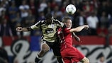 Twente's Tim Cornelisse (right) fights for the ball with Emerson of Benfica