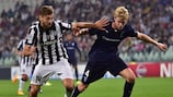 Fernando Llorente and Filip Helander vie for possession during Malmö's defeat in Turin on their group stage debut