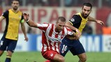 Pajtim Kasami and Arda Turan tussle for possession during Olympiacos's 3-2 win over Atlético in September