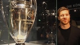 Xabi Alonso poses with the UEFA Champions League trophy at the Bayern museum