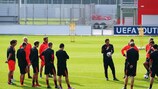 Roger Schmidt gathers his players during training on Tuesday morning