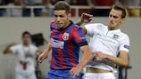 Steaua goalscorer Alexandru Chipciu battles with Yordan Minev of Ludogorets