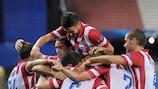 Miranda, buried beneath his team-mates, scored Atlético's first goal of the campaign