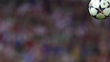 Barça's Javier Mascherano challenges Atlético's Adrián López
