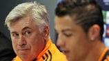 Carlo Ancelotti listens to Cristiano Ronaldo at Tuesday's press conference