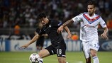 Gonzalo Castro tries to hold off Lyon's Miguel Lopes during the first leg