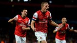 Podolski fires Arsenal to Olympiacos victory