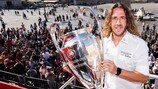 Carles Puyol shows off the trophy in Rome