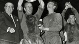 Manchester United captain Bobby Robson hold aloft the trophy after his team's 4-1 victory against Benfica at Wembley
