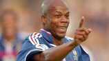 Sylvain Wiltord scores France's third goal in the 3-0 group stage win against Denmark.