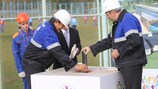 Michel Platini and Sergei Roumas plant a capsule into the foundations of the training centre