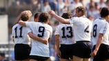 Rudi Voller (No9) is congratulated after scoring against Romania