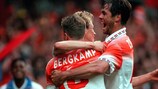Dennis Bergkamp is congratulated after scoring the second goal