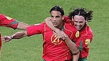 Nuno Gomes (centre) celebrates Portugal's winner with Maniche (right) and Deco